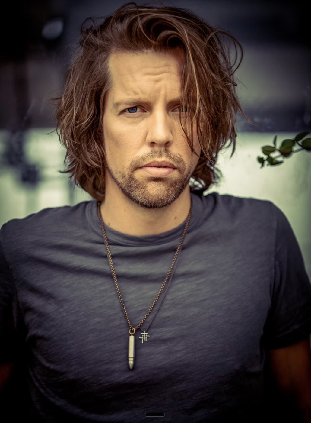 Shawn-Caulin Young in a charcoal shirt, photographed by Mason Trueblood